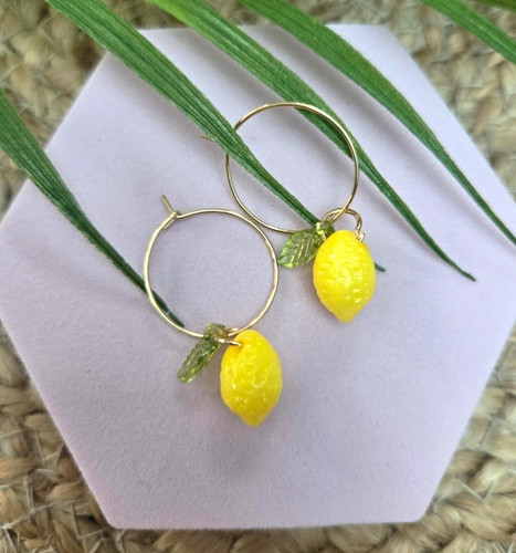 Gold tone hoop earrings with - tone,